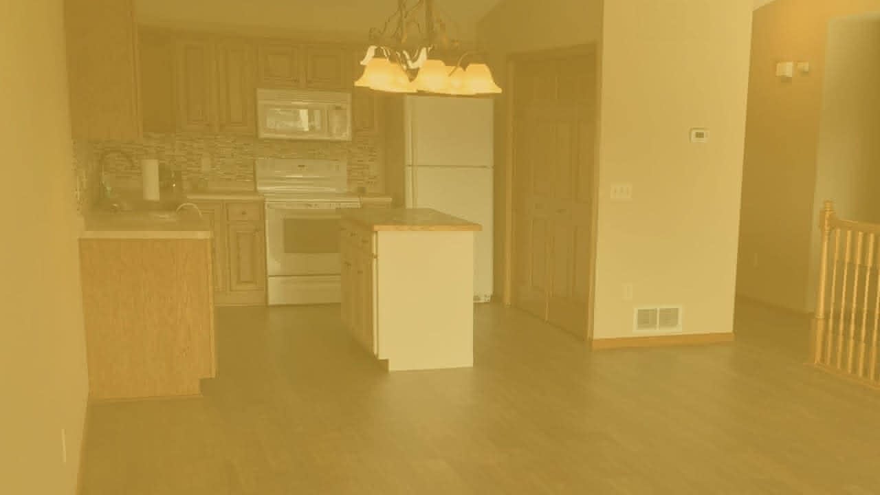 A kitchen in a home with beautiful flooring